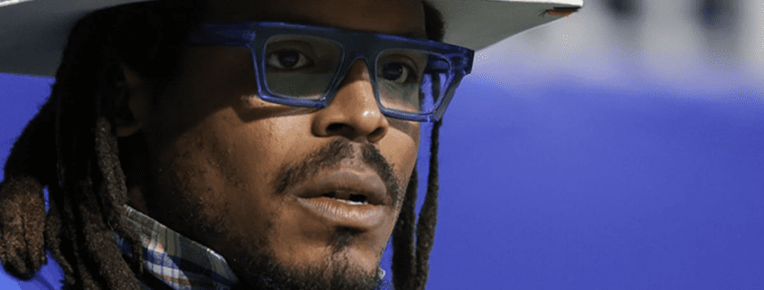 Man wearing glasses and a cowboy hat.